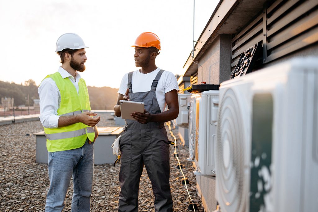 Field service technicians reviewing service orders on a tablet